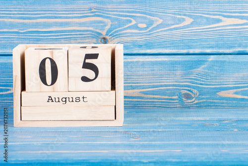 August 5th. Date of 5 August on wooden cube calendar