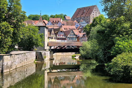 Beautiful Old Town of Schwabisch Hall, Germany with riverside half timbered houses and covered bridge
