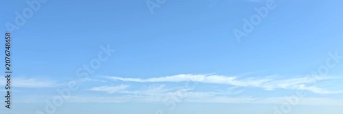 Cloudscape, Timelapse of beautiful blue sky with scattered wispy clouds on horizon, for wide background	