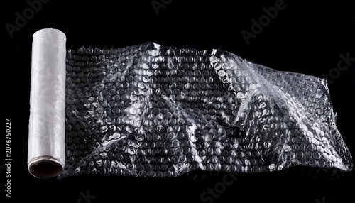 torn bubble wrap plastic packaging texture on black background