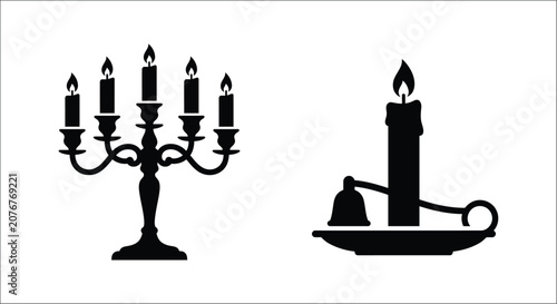 Tableau sur toile Black silhouette of a five arm candelabra and single candlestick with burning ca
