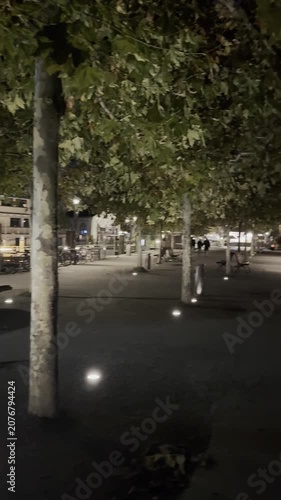 Konstanz, Germany - October 19, 2025: Evening views of the waterfront, harbor and city streets at Lake Constance with urban lights, reflections and pedestrians. Editorial use only.