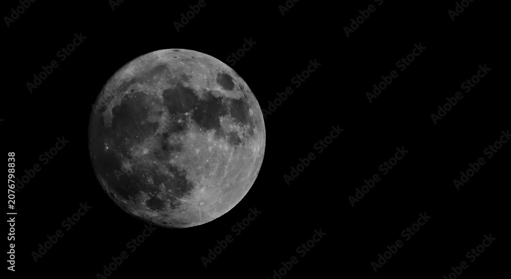 Fototapeta premium Full moon isolated on black background