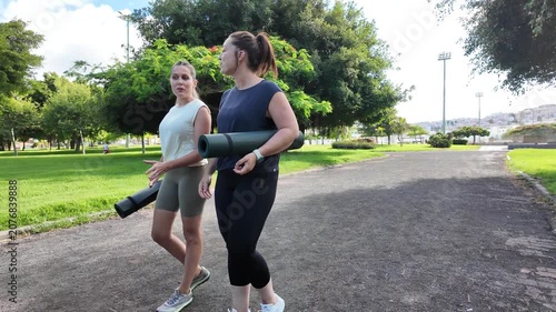 Friends strolling through the park after a day of outdoor training