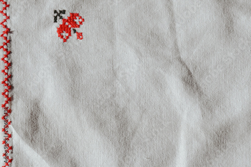 Konstfotografi vintage embroidered cross stitch tablecloth in close up