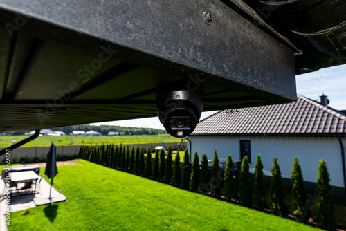 Dome security camera monitoring home yard for safety