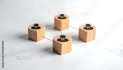 Wooden blocks with icons representing human resources, team building, networking, corporate structure, management, collaboration, partnership