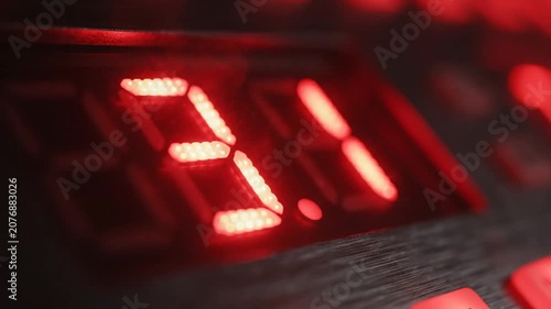 Red digital timer display showing numerical countdown progress.