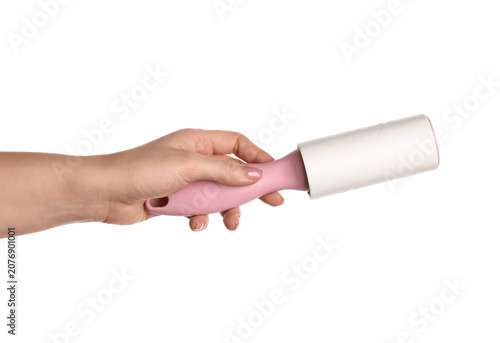 Female hand with lint rolle...