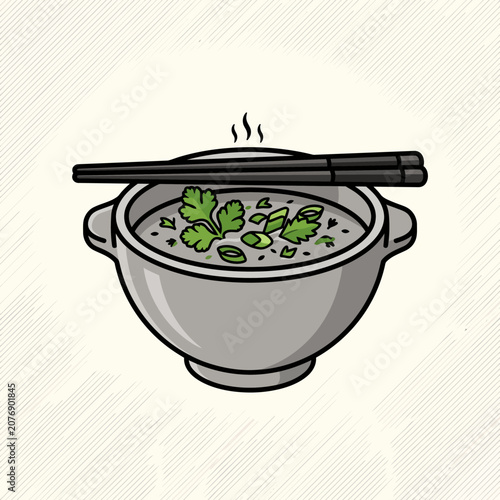Bowl of hot soup with chopsticks and herbs