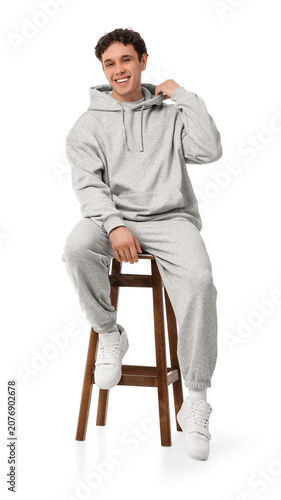 Young man in grey sports su...
