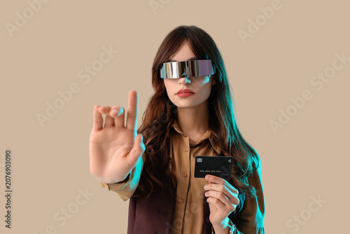 Young businesswoman in AR g...