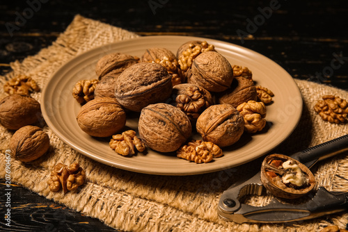 Plate with tasty walnuts an...