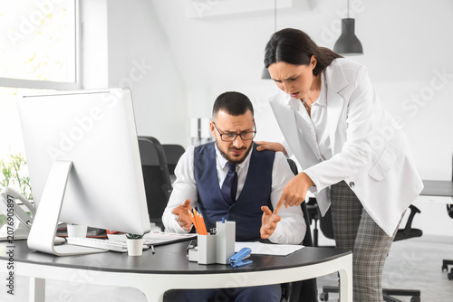 Angry female boss scolding ...