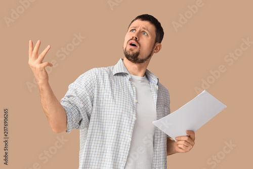 Male actor with film script...