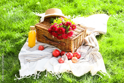 Wicker basket with flowers,...