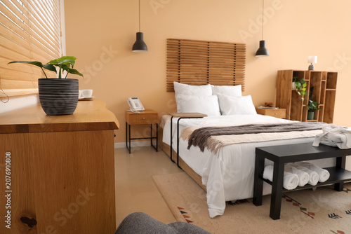 Bedside table with folded b...