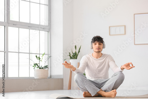 Young man in headphones med...
