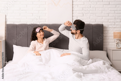 Happy couple with sleeping ...