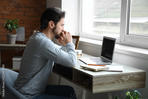 Portrait of worried man sit...