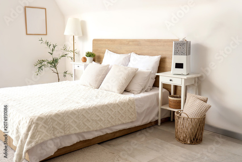 Interior of light bedroom w...