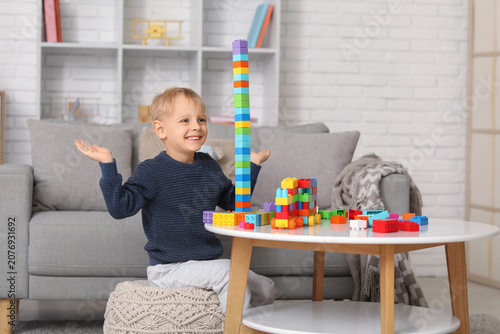 Happy cute little boy build...