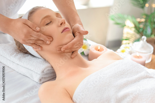 Young woman having facial m...