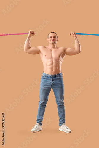Male bodybuilder with measu...