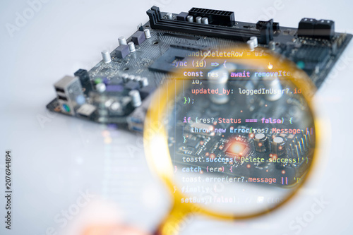 Quadro su tela Magnifying glass inspecting electronic circuit on computer motherboard with software code overlay, representing cybersecurity, embedded systems, semiconductor engineering, programming and technology