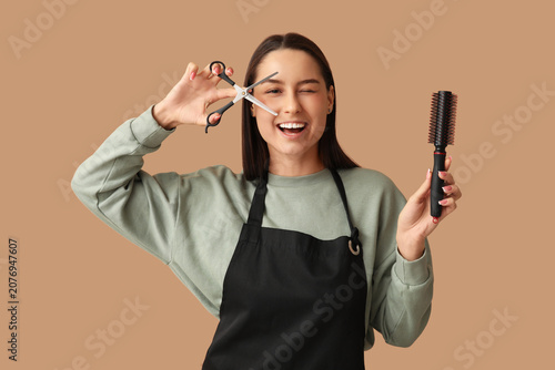 Female hairdresser with sci...