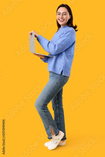 Pretty young woman working ...