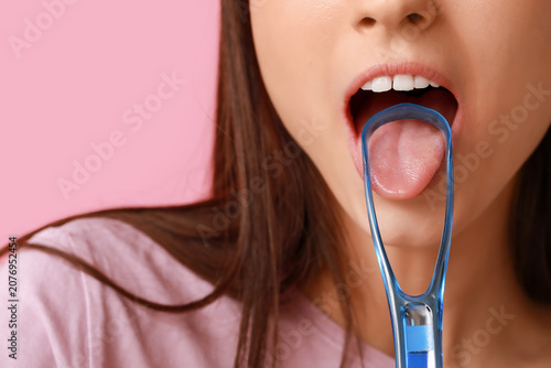 Young woman with tongue scr...