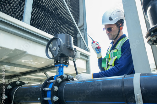 Engineer maintenance hvac cooling tower technician safety helmet valve inspection conduct inspection and maintenance for hvac cooling tower under safety with helmet and valve check