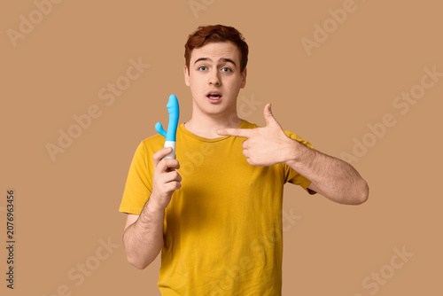 Shocked young man pointing ...