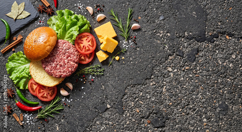 Hamburger ingredients on rough asphalt