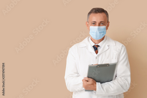 Mature doctor in medical ma...