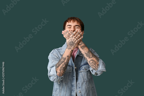 Laughing young man on dark ...