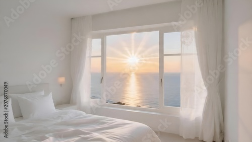 Beautiful bedroom interior with a stunning ocean sunset view through a large window.