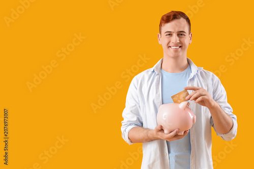 Young man with credit card ...
