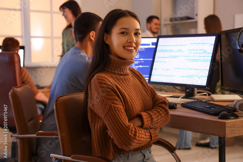 Female Asian programmer wor...
