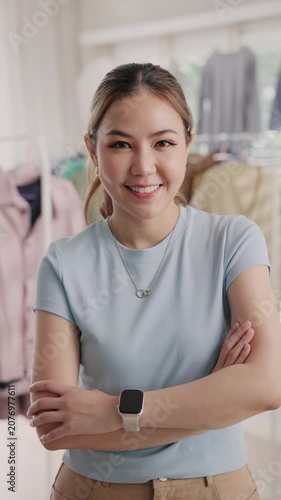 Young adult asia woman people smile look at camera work happy old used heap shirt sale online second hand sell thrift store. Go green eco fabric reduce zero waste issue side hustle small home shop.