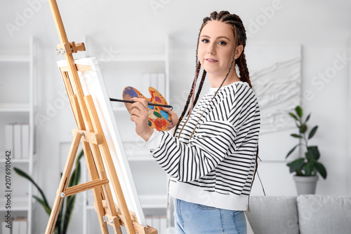 Young woman with dreadlocks...
