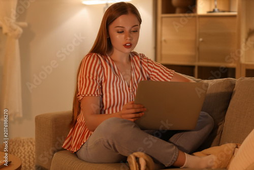 Young woman working with la...