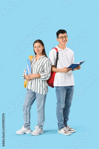 Happy students with backpac...
