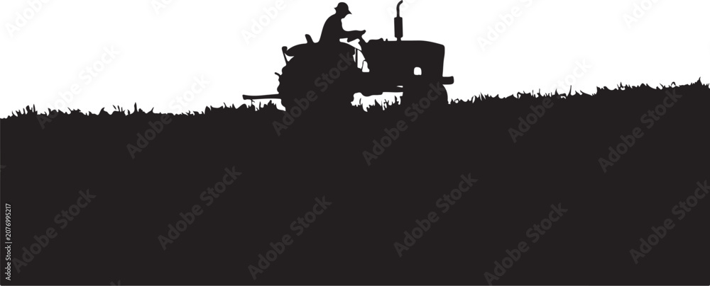 Obraz premium Silhouette of a tractor driver on a field, against a grass