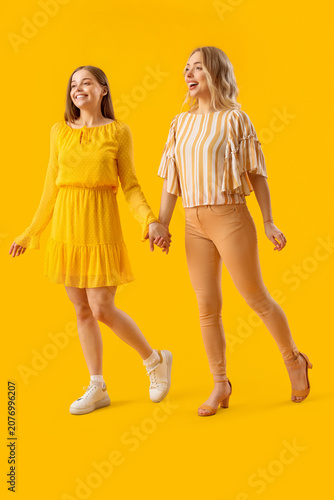 Young sisters holding hands...