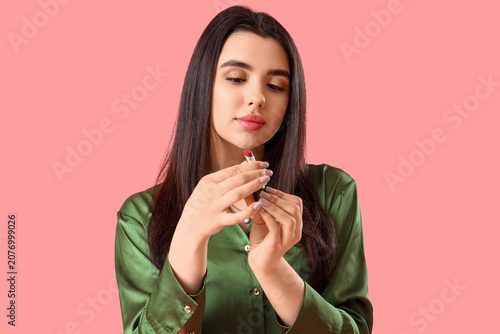 Pretty young woman with lip...