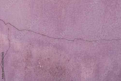Photos A weathered, painted concrete wall surface