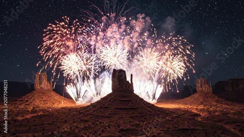 Fireworks explode over ancient USA Independence Day monument at night