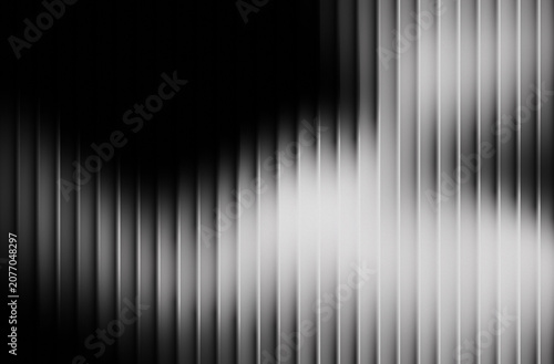 Fotografie Abstract monochrome background with vertical striped texture and dramatic light